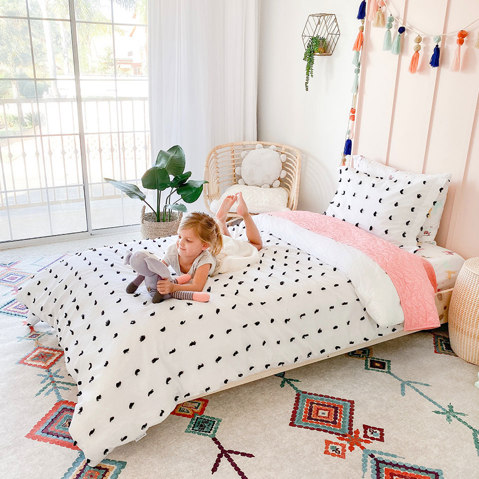 Colorful geometric rug in girls bedroom