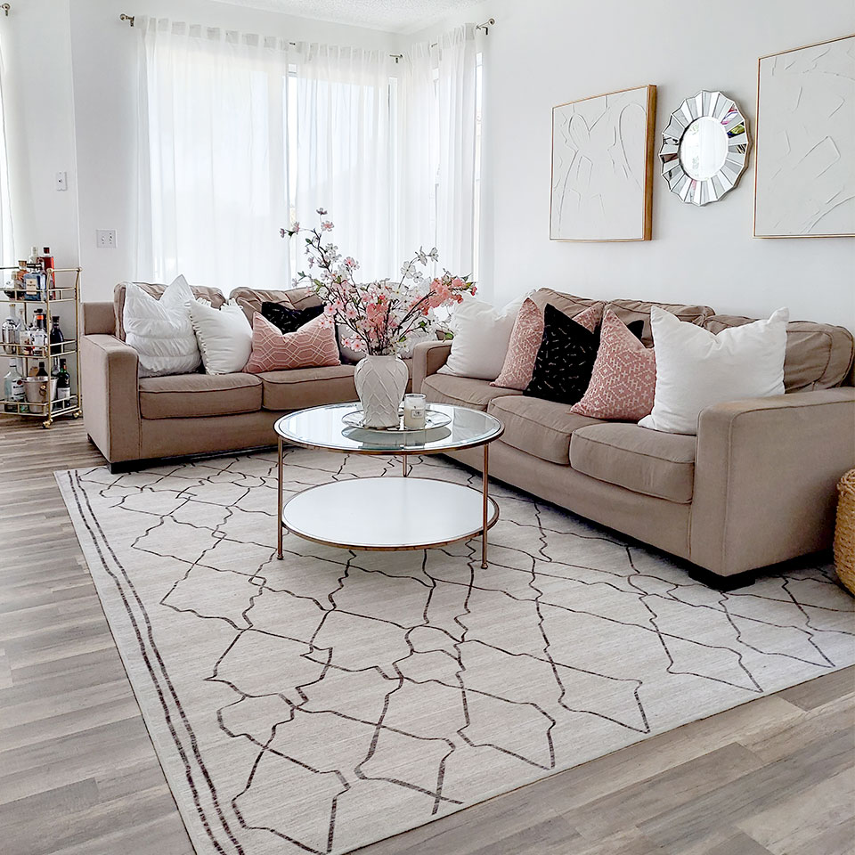 Beige and brown moroccan rug with brown couch in the living room