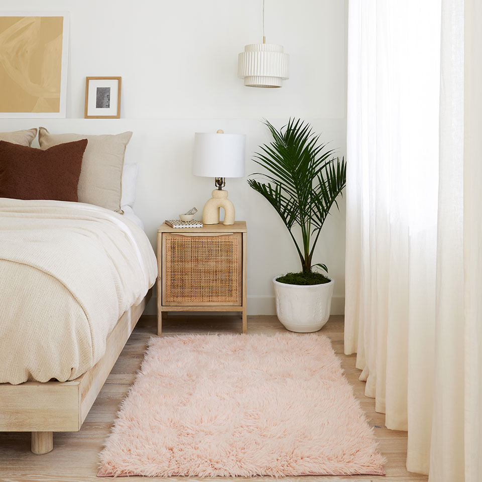 pink shag rug in bedroom