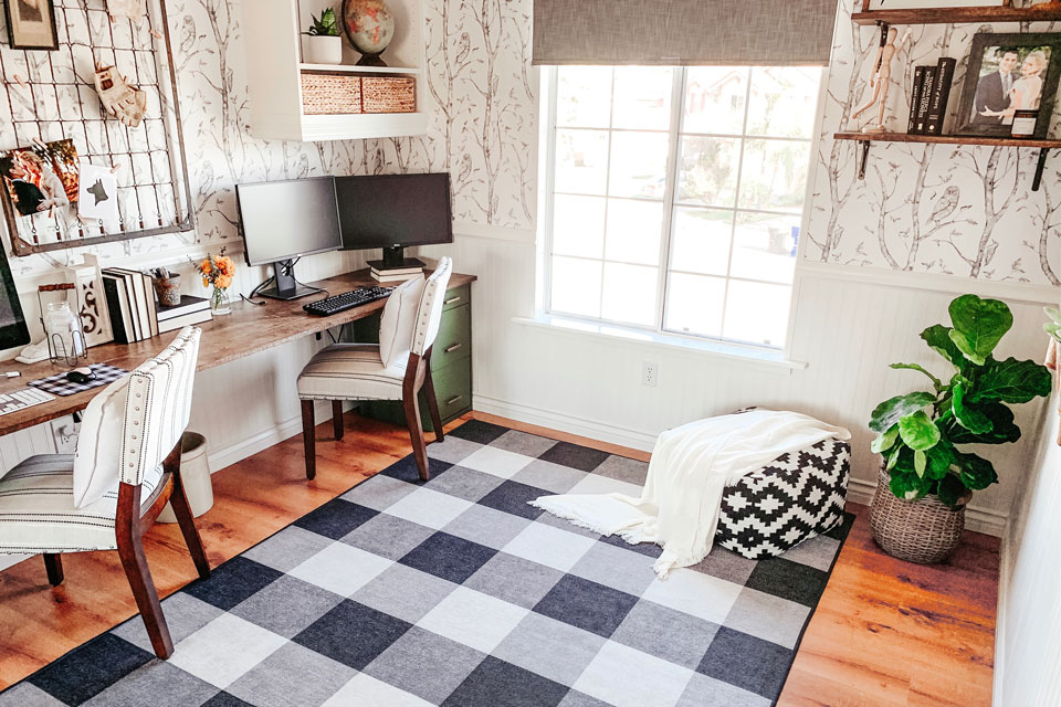 Cozy home office with a black and white plaid area rug.