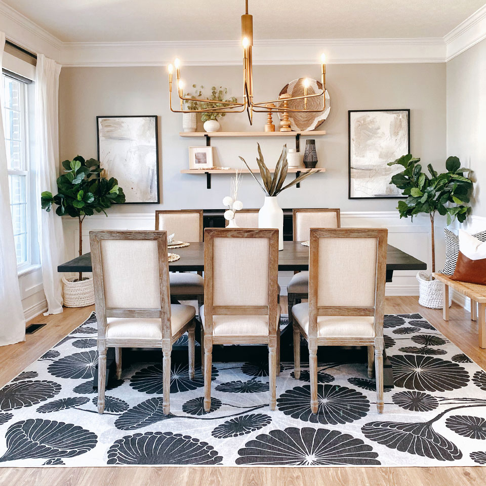 Black and white big floral rug in dining room