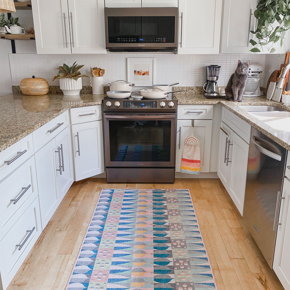 Colorful pastel kitchen rug with cat