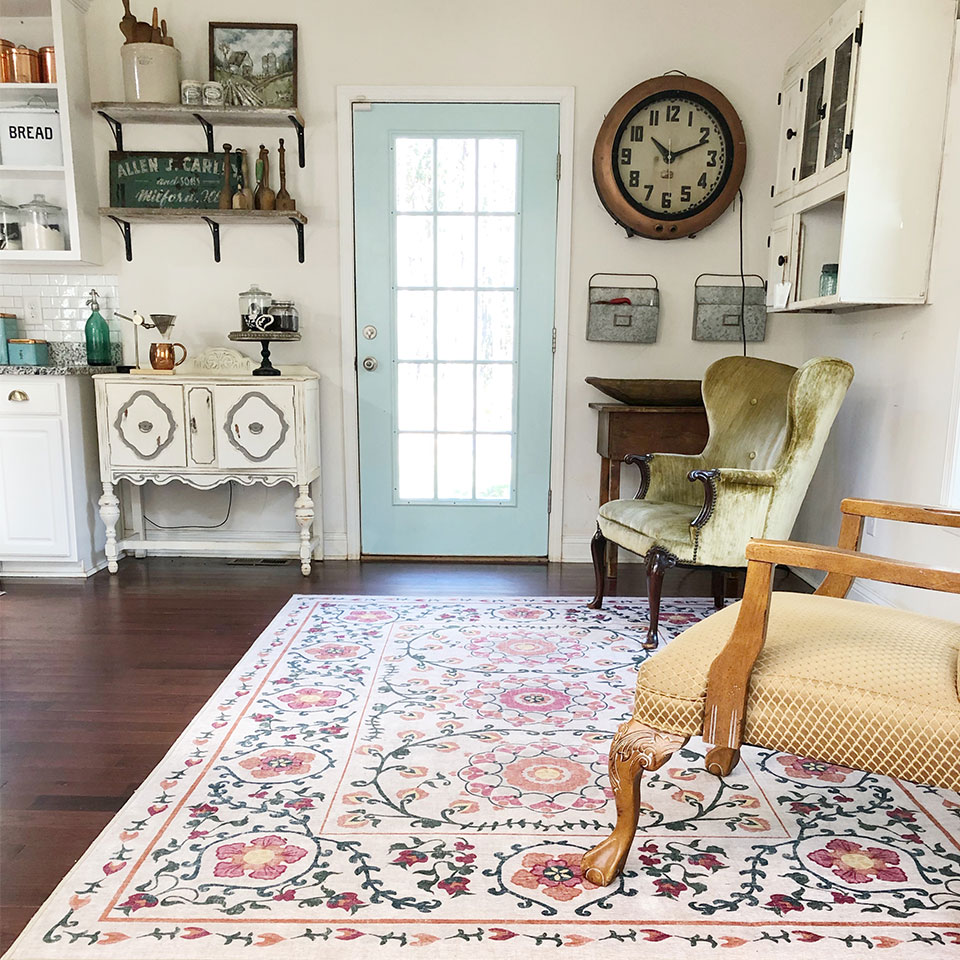 Suzani Floral vintage rug by the entryway