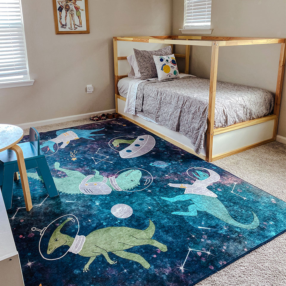 Dinosaurs in space blue rug in boys bedroom