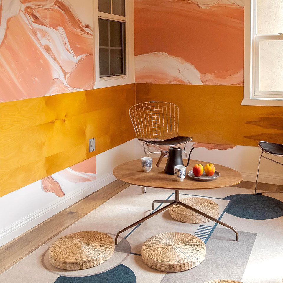 Plano geometric rug in tea room with orange walls