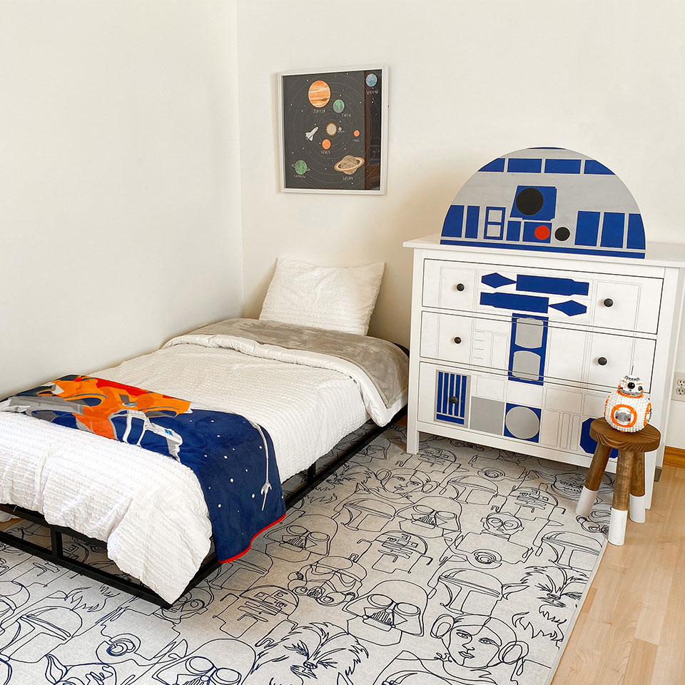 Star wars themed boys bedroom with black and white star wars rug