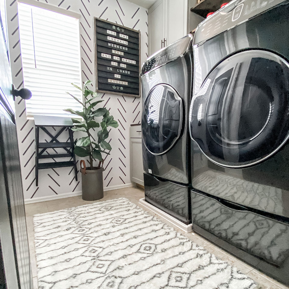 White plush rug with geometric pattern in black and white laundry room