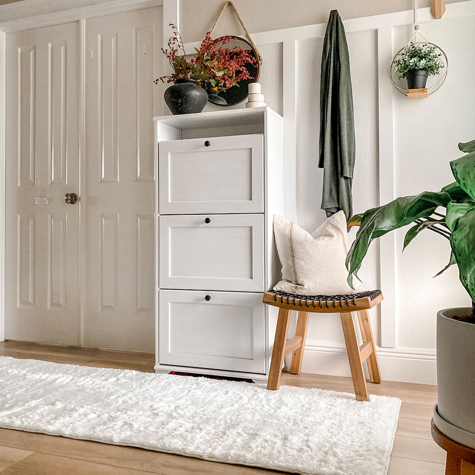 White plush runner rug by entryway with plants