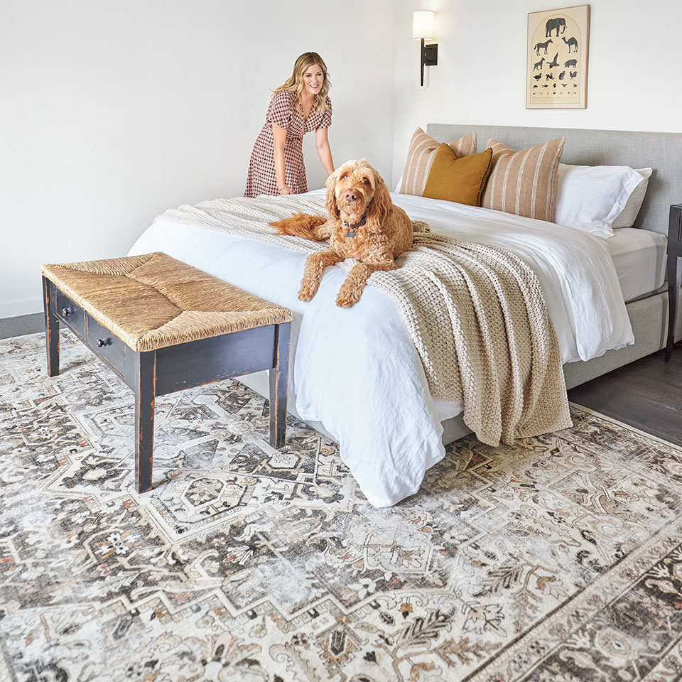 Brown farmhouse rug in the bedroom with Jeneva Bell and dog