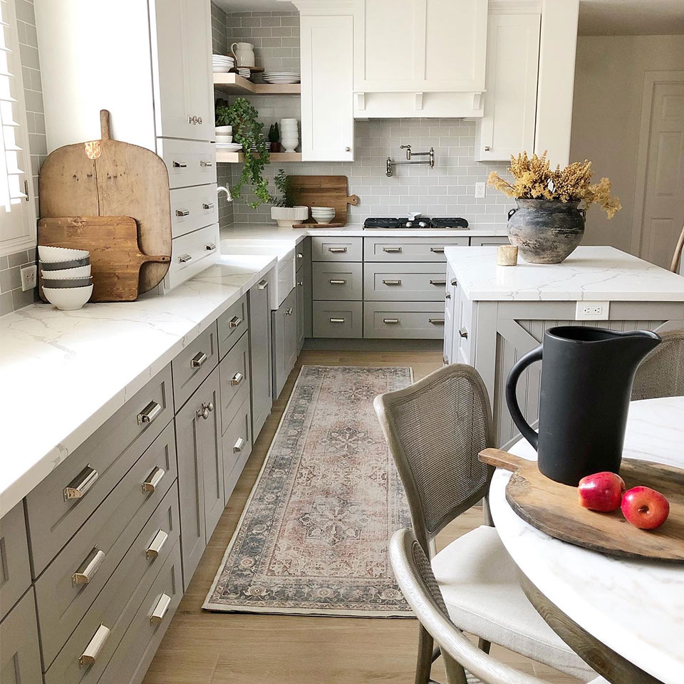 Farmhouse runner rug in kitchen with grey and white cabinets