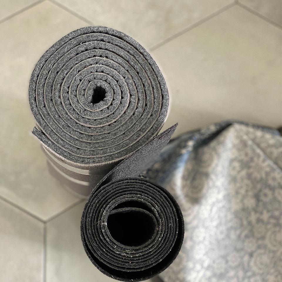 Thin and thick rug pad rolled up