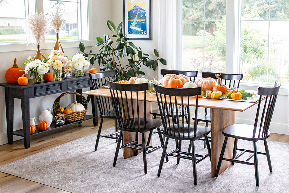 Dining room decor ideas with pumpkin and wood table with grey dining room rug
