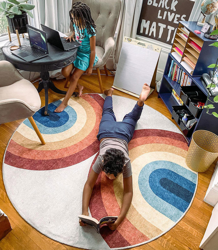 Round rainbow rug in kids study