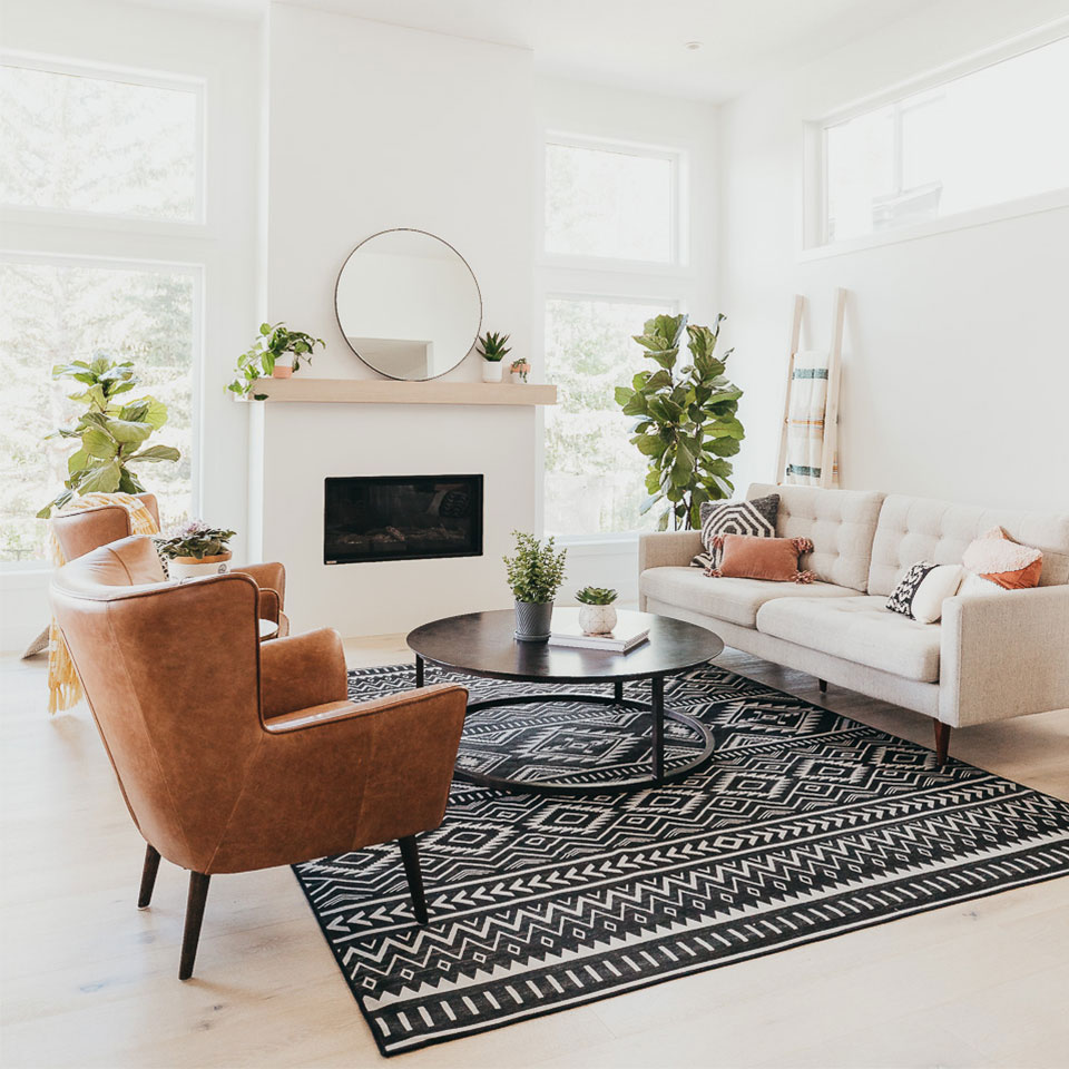 black and white geometric fireplace rug in living room