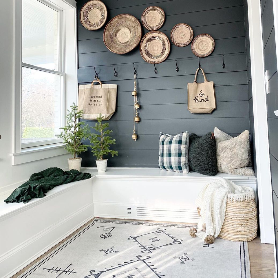 grey and white traditional rug in mudroom with black shiplap