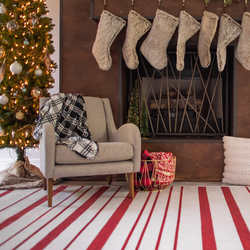 red and white fireplace rug with christmas decorations