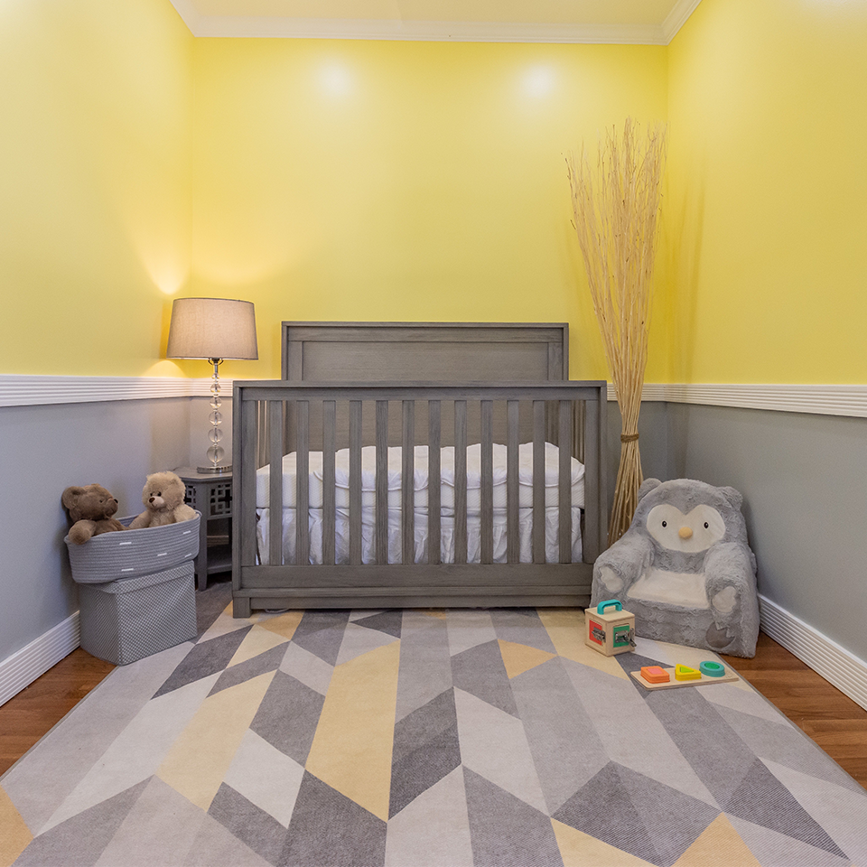 grey and yellow nursery kids room with grey and yellow rug