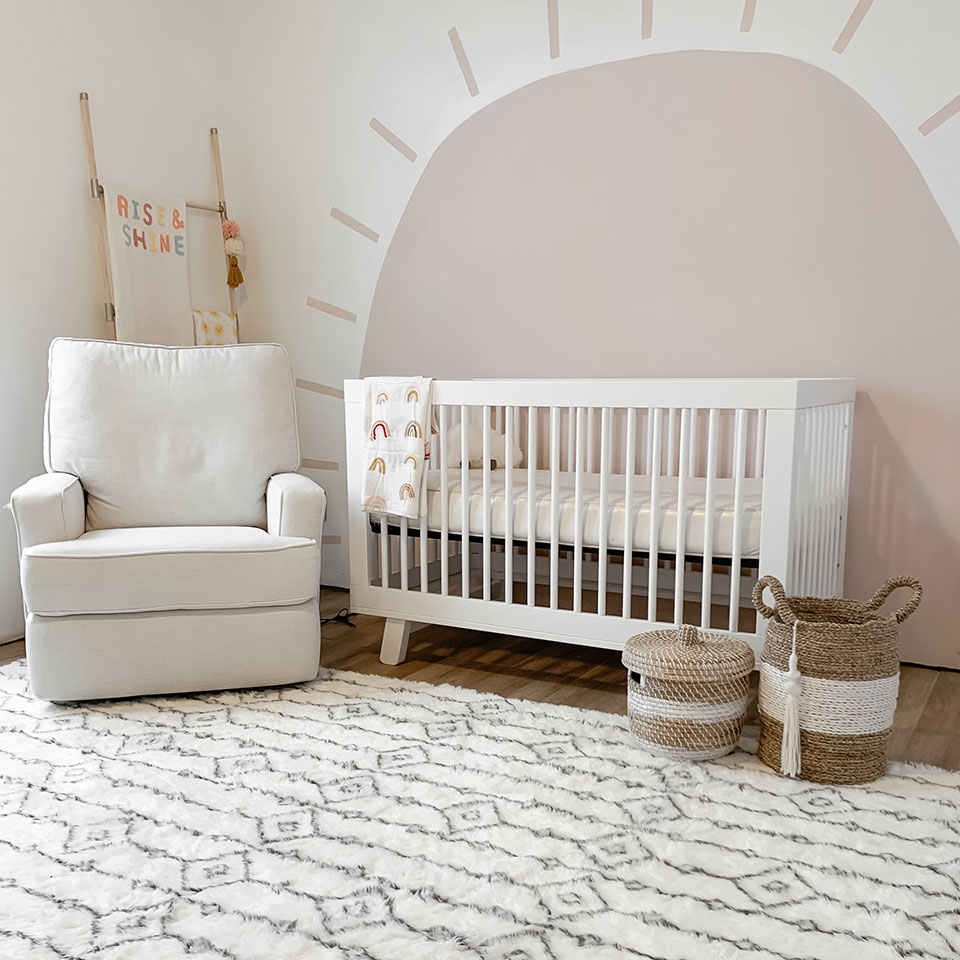 white plush nursery rug with mural and white decor