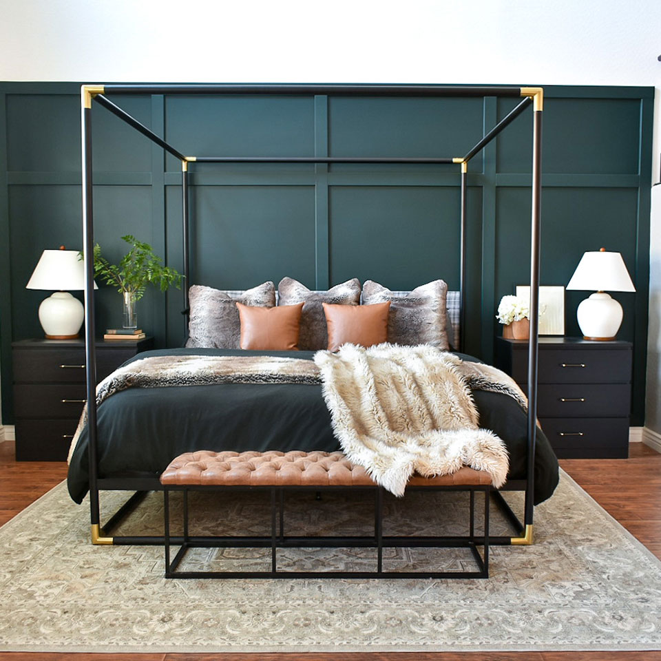 cream persian rug in bedroom with dark green wall