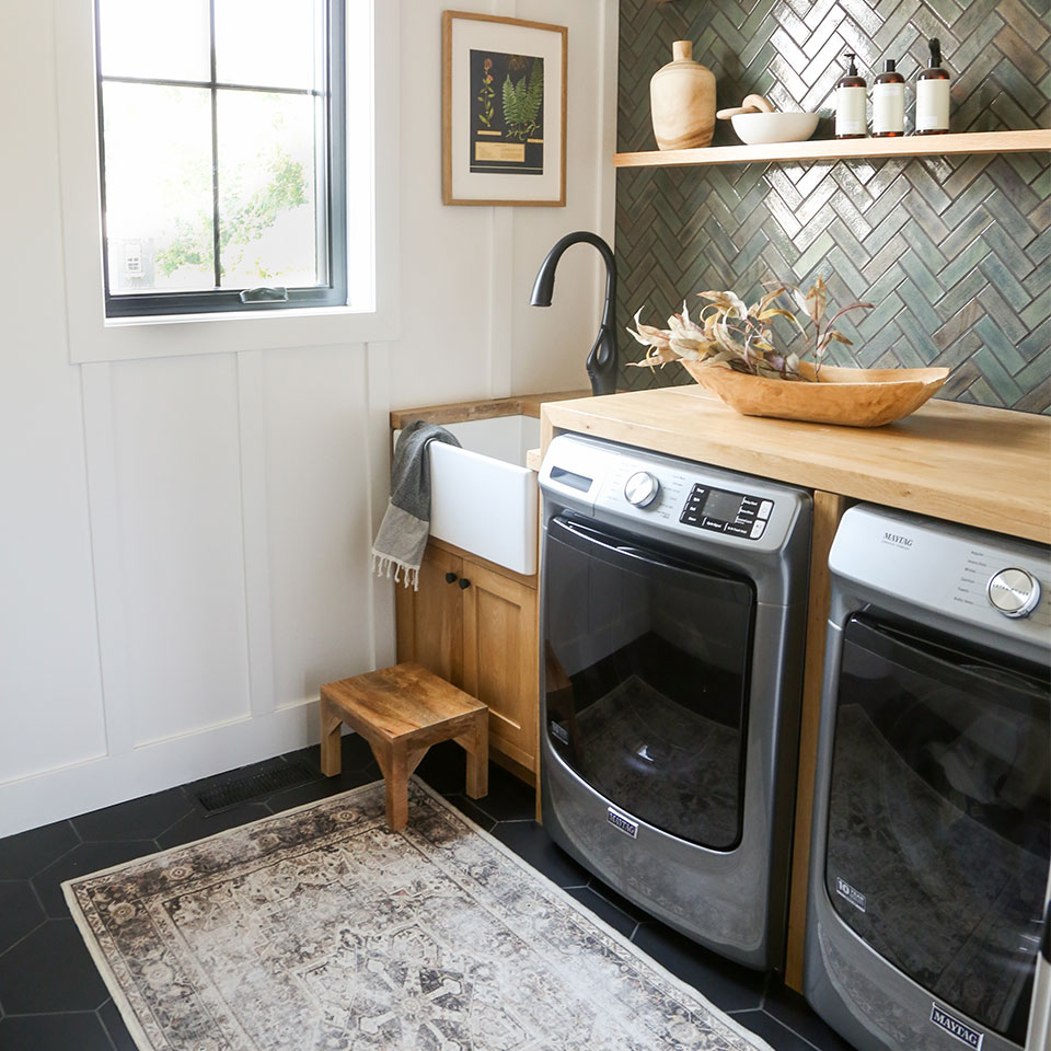 brown and taupe persian rug in laundry room