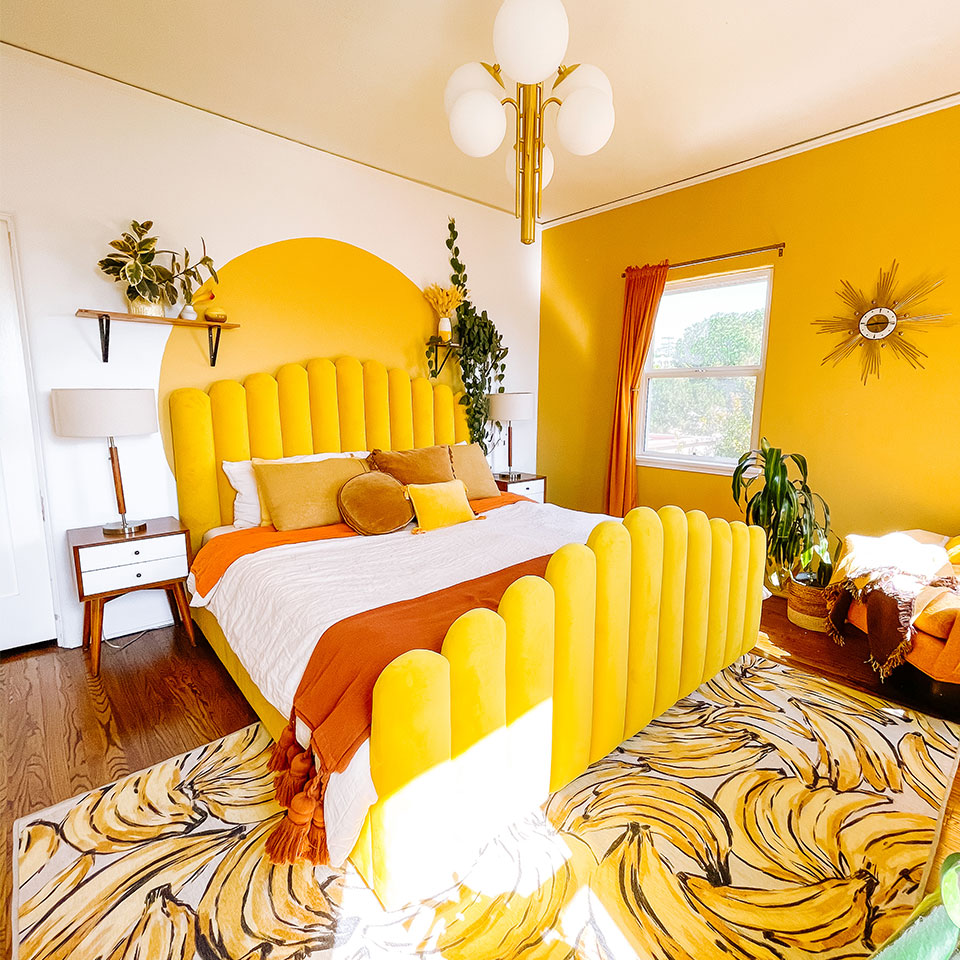 spring yellow fruit rug in bedroom with yellow bed and orange decor