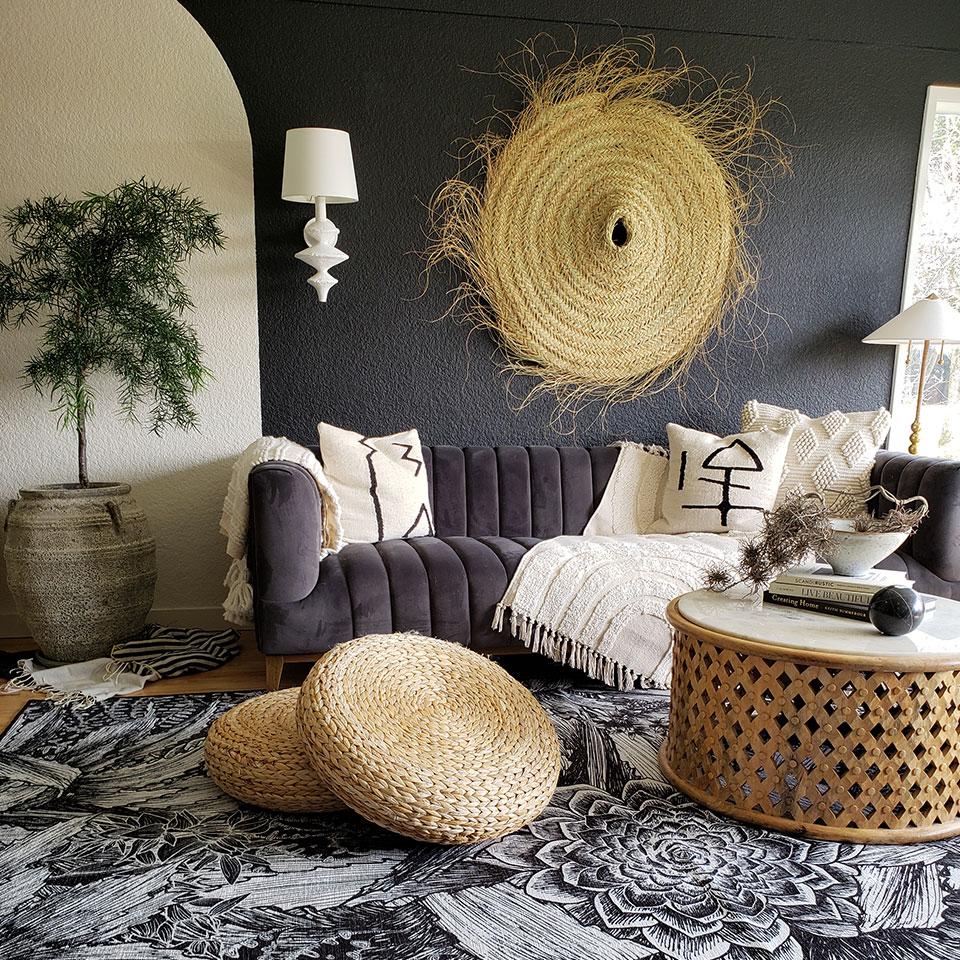 black and white rug in living room with spring decor