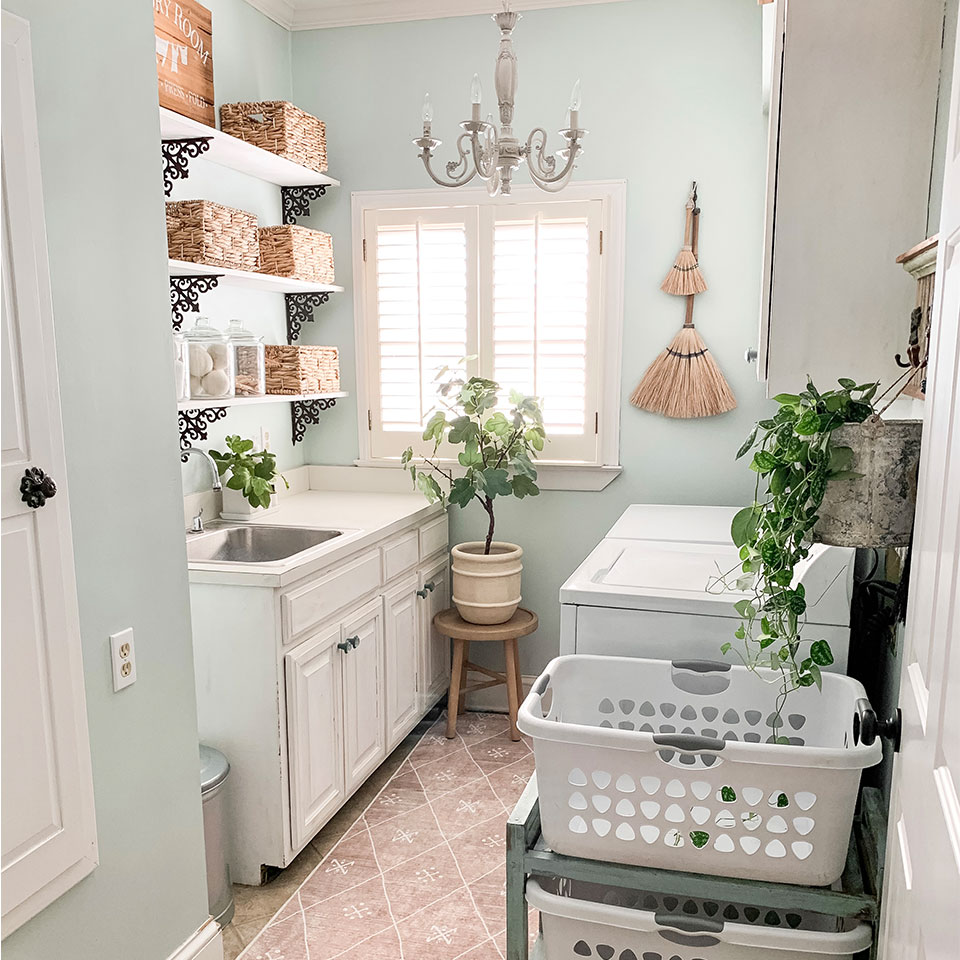 pale pink boho runner in laundry room with chandelier
