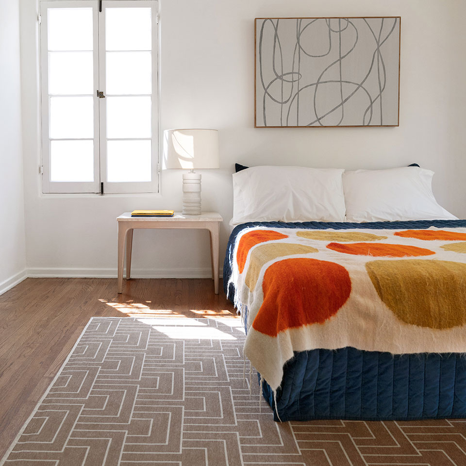 vintage inspired bedroom with art deco rug