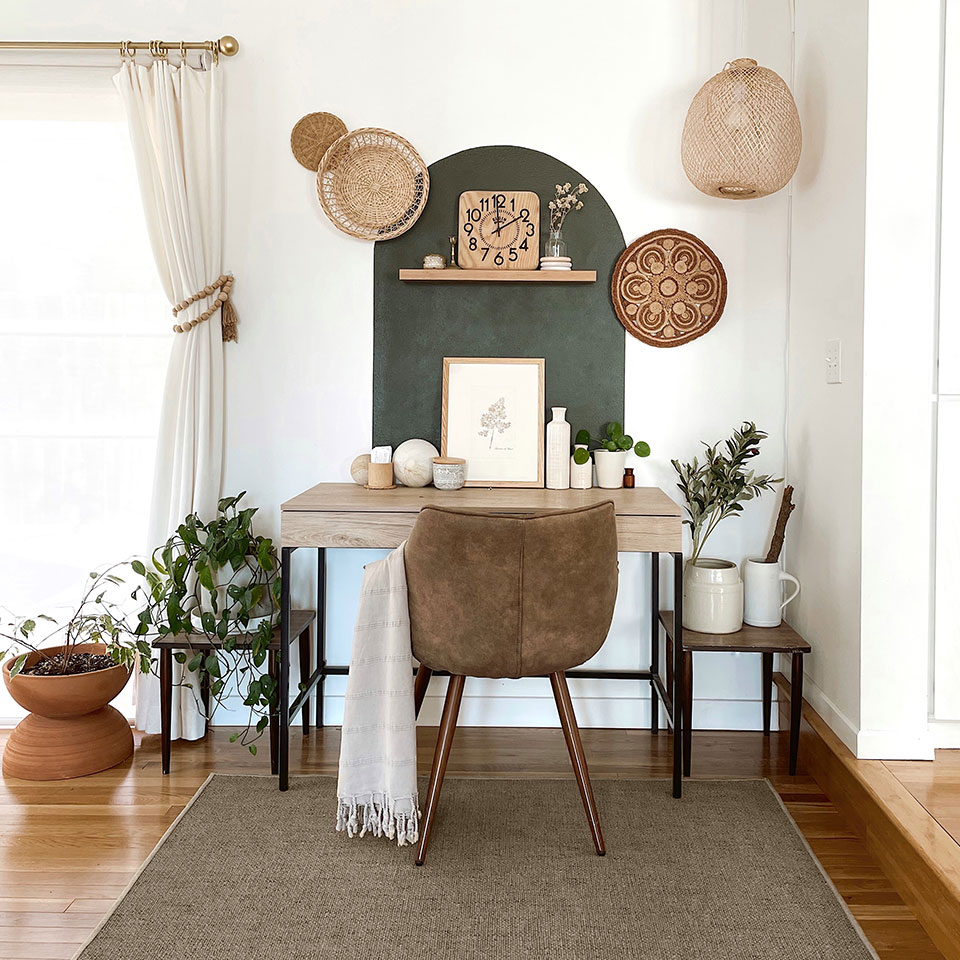 Re-jute rug in desert style home office with velvet chair and wooden desk