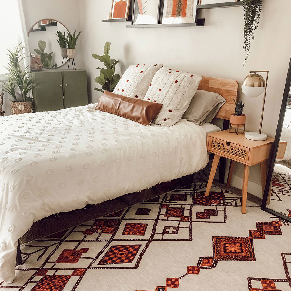 orange moroccan rug in boho bedroom