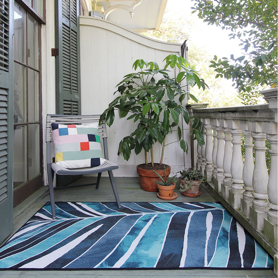 outdoor blue and teal rug on balcony