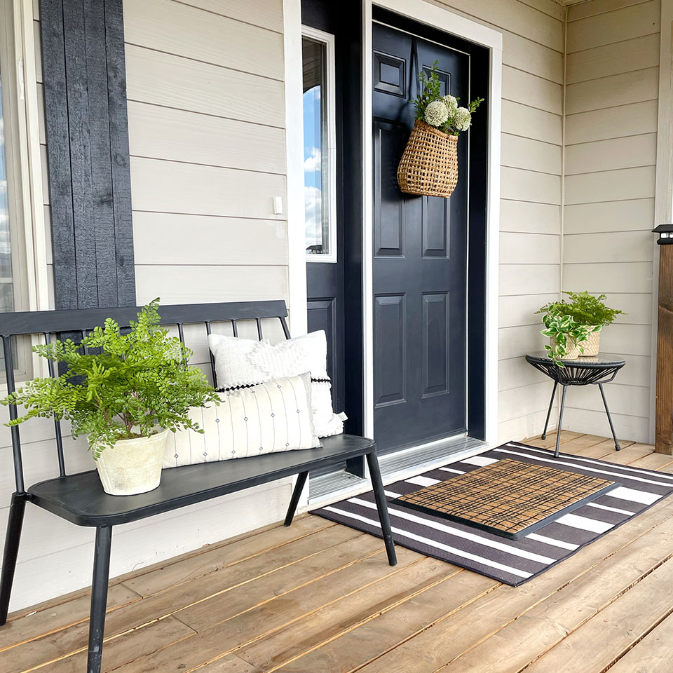 small outdoor striped rug and doormat at entrance