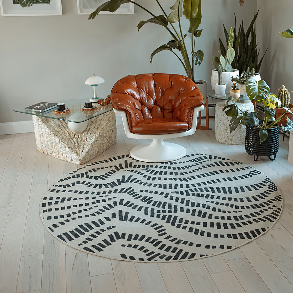 unique black and white round rug in living room