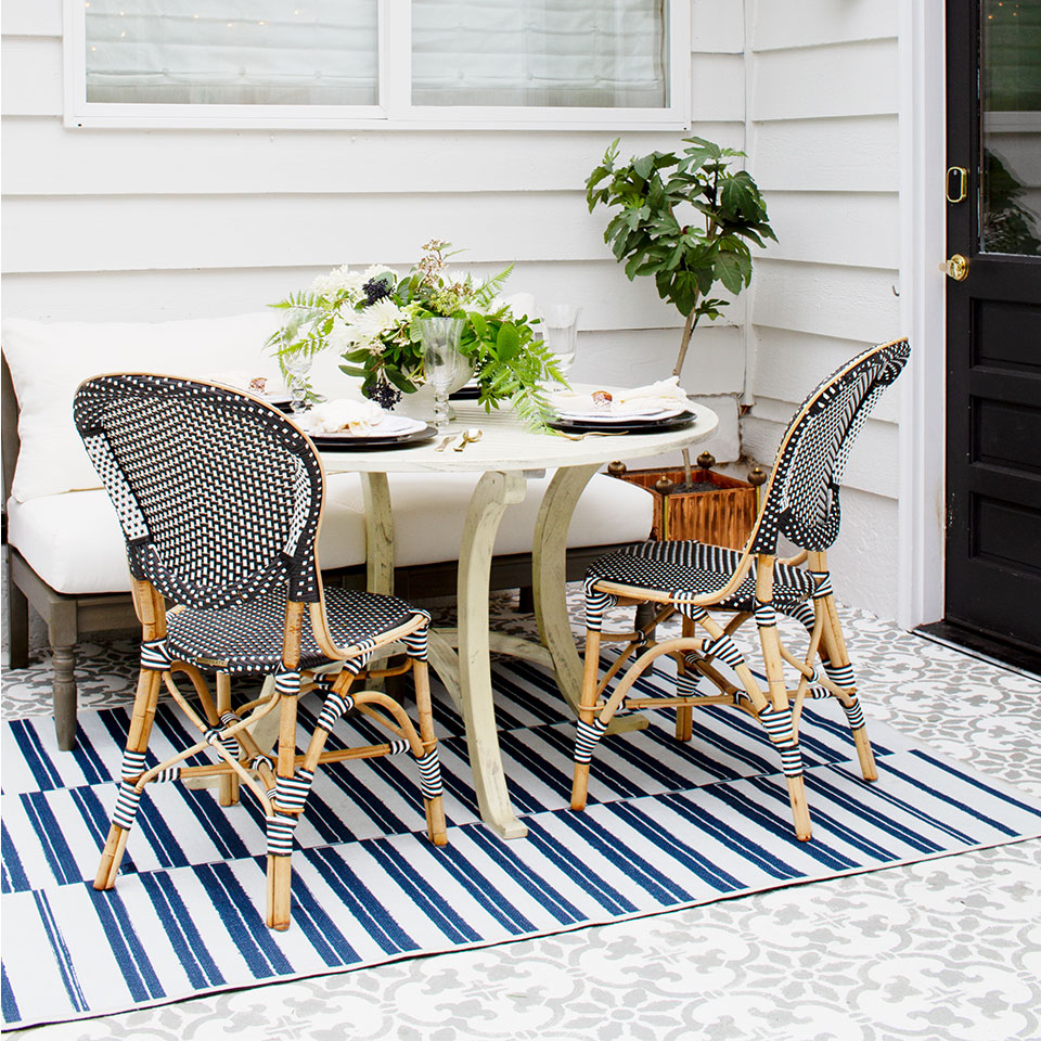 blue and white outdoor rug on patio