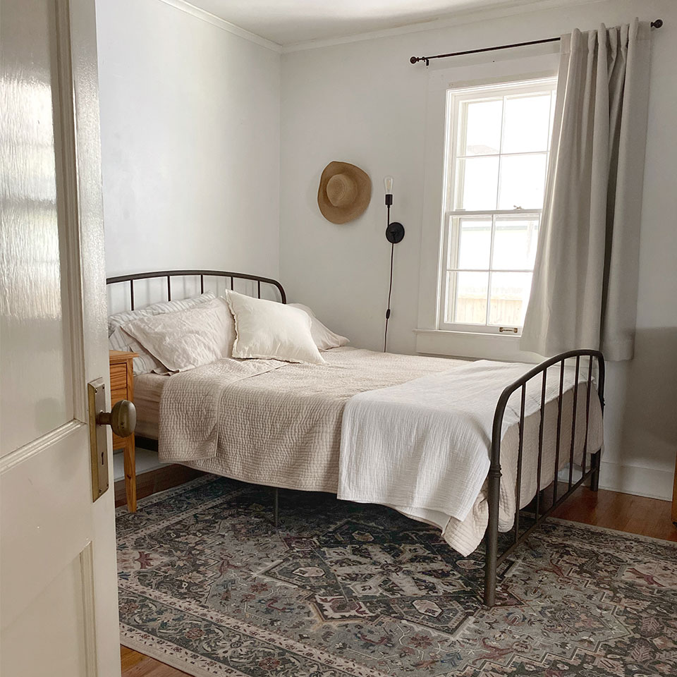 calming green persian rug in bedroom