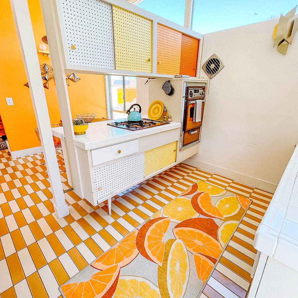energizing orange and yellow fruit runner rug in kitchen