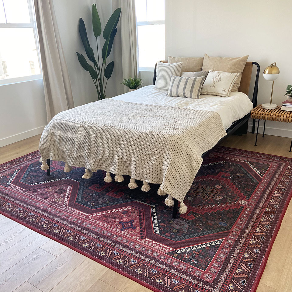 energizing red persian rug in neutral bedroom