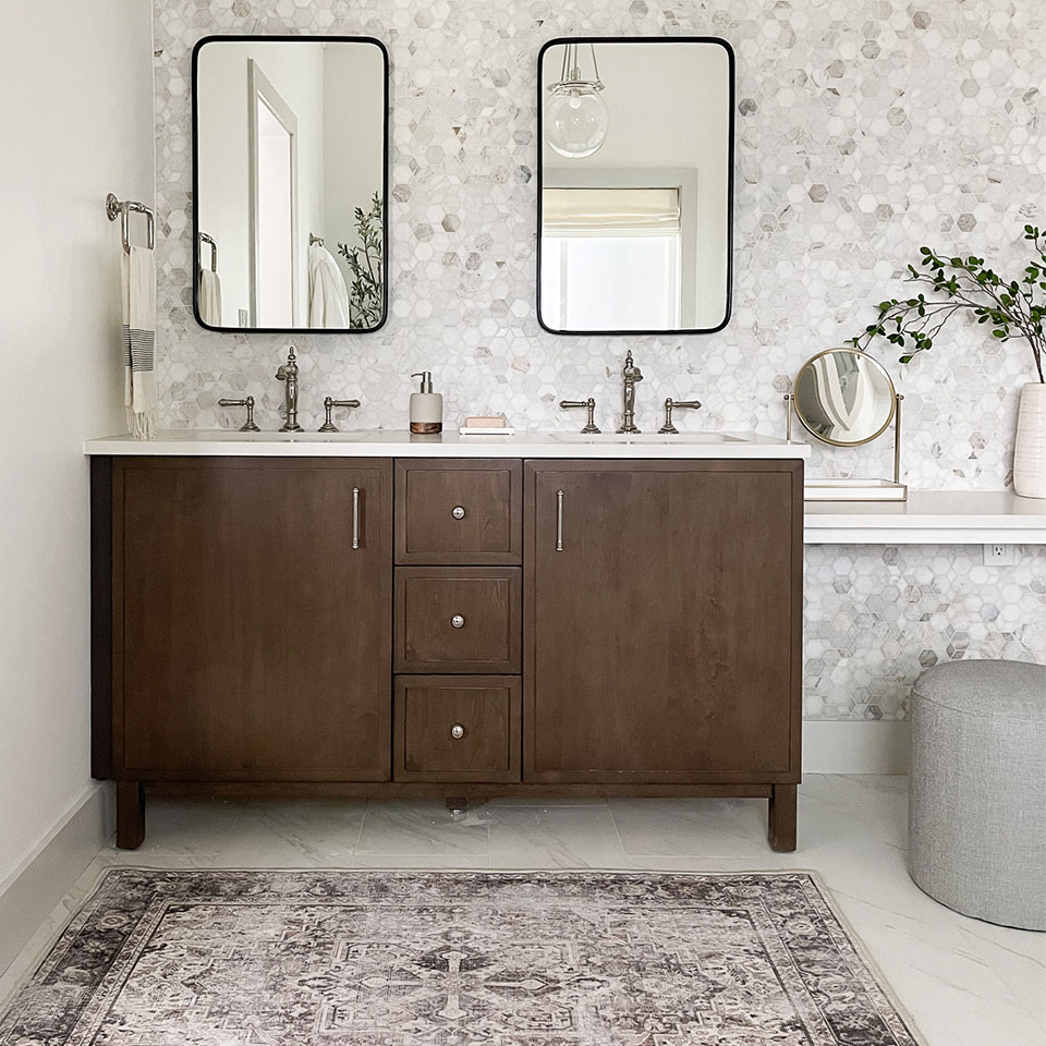 small taupe persian rug in bathroom
