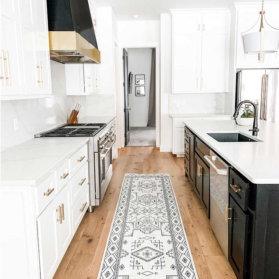 black and white runner rug in modern kitchen