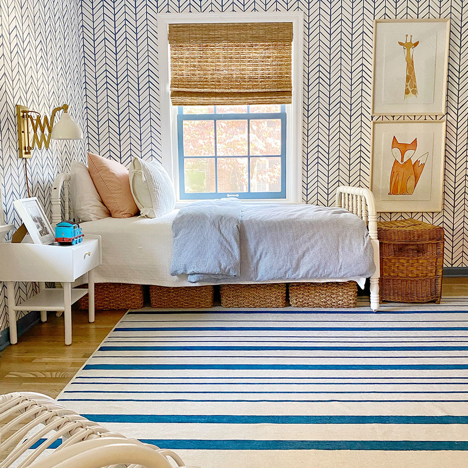 blue and white striped rug in boys bedroom