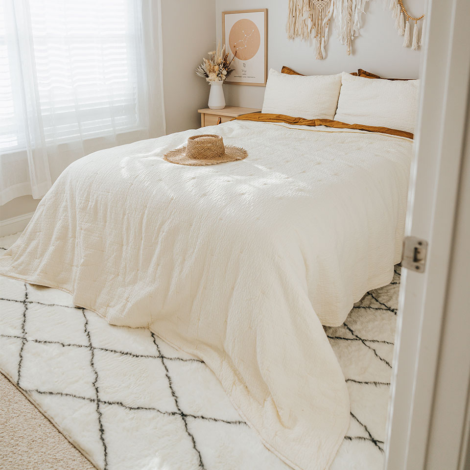 plush white rug in small bedroom