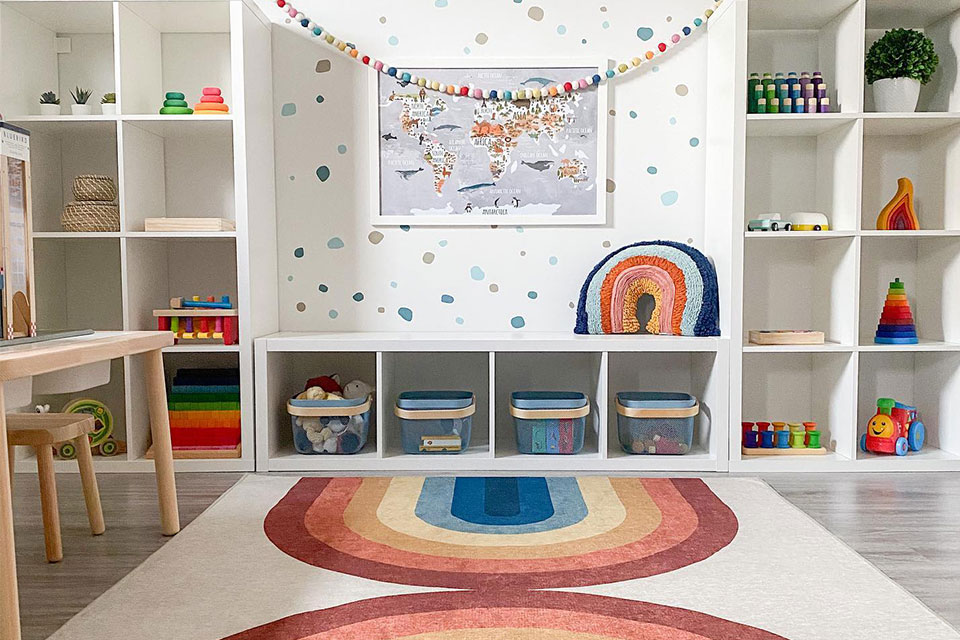 colorful rainbow rug in kids playroom