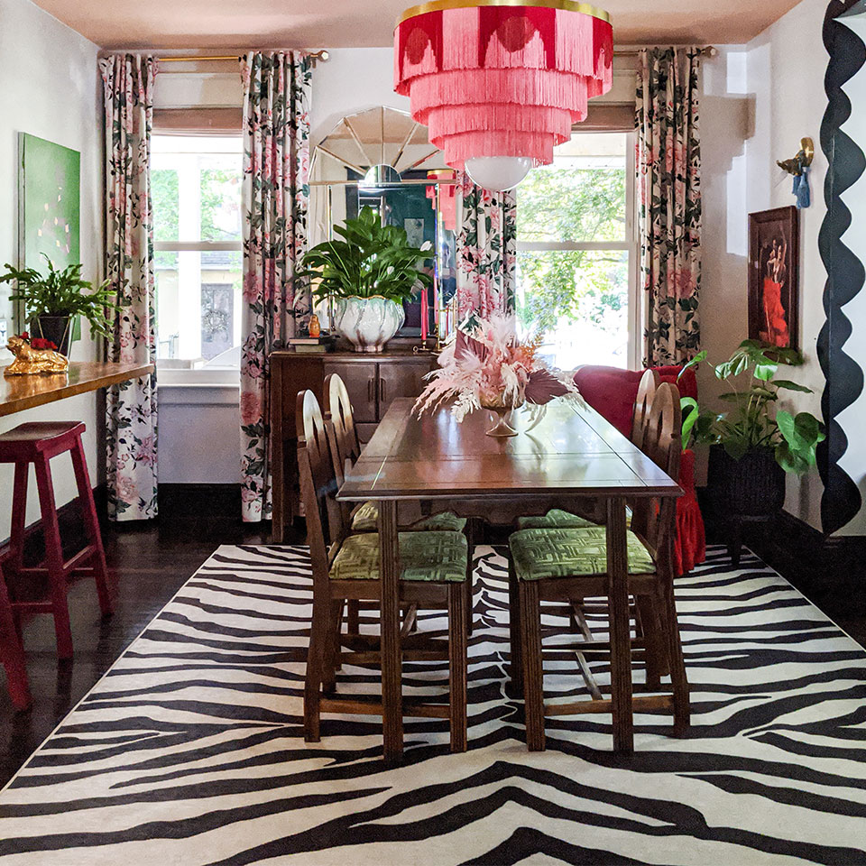 black and white zebra rug in eclectic dining room