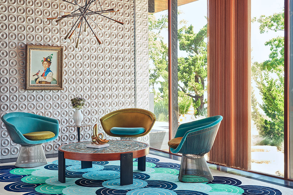maximalist teal and blue rug in living room