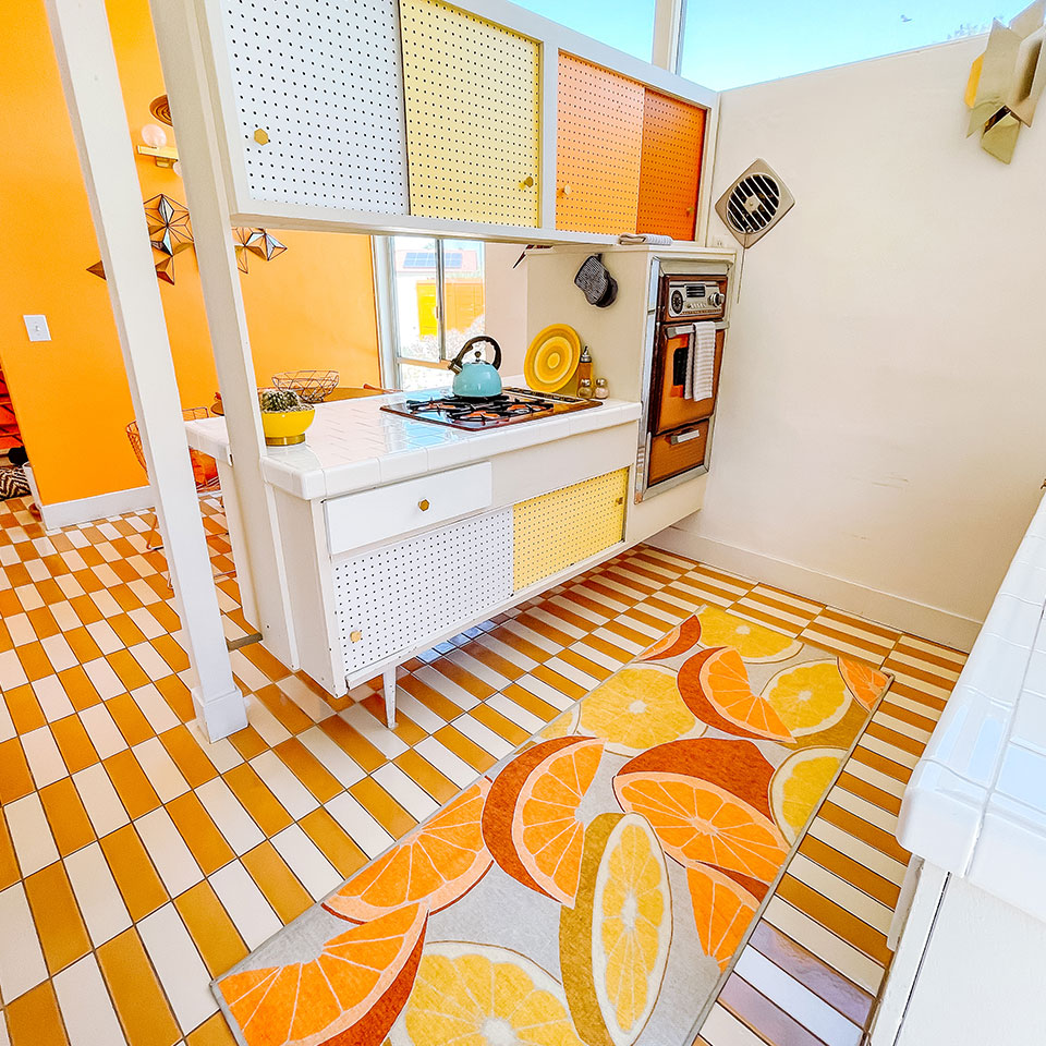 orange and yellow fruit retro rug in kitchen