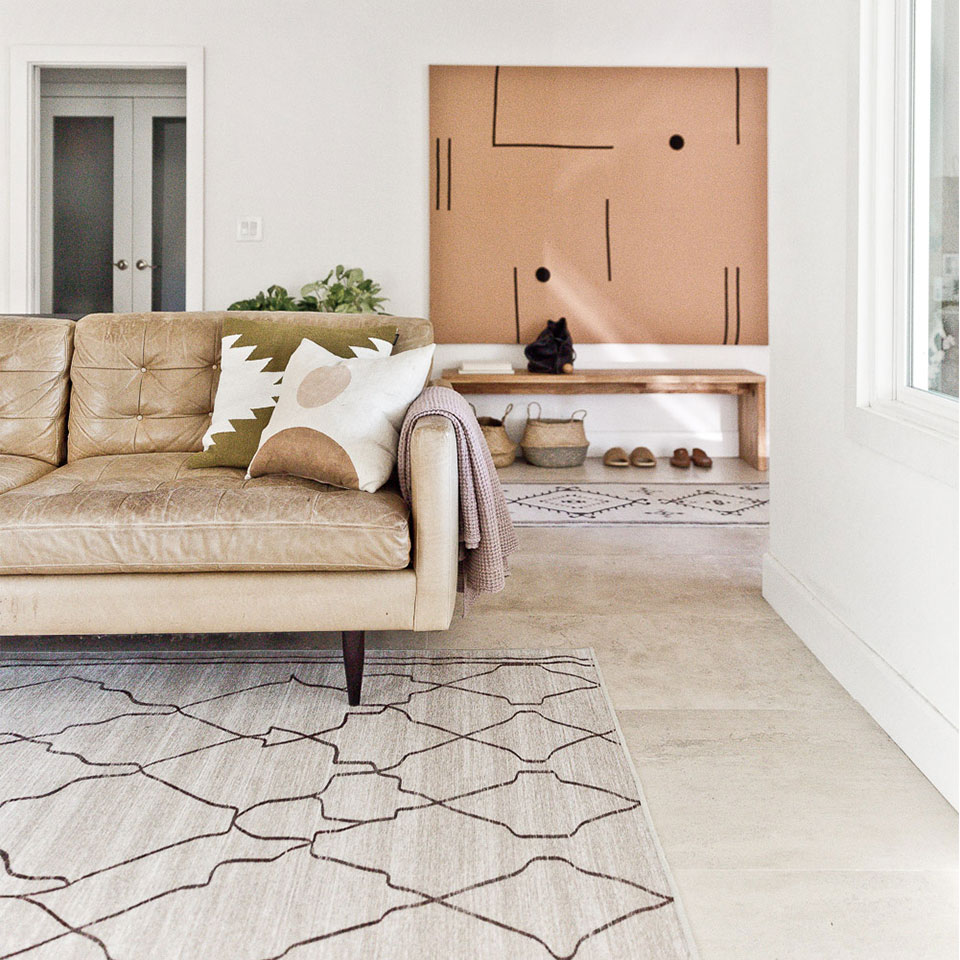 tan and white abstract rug in modern living room
