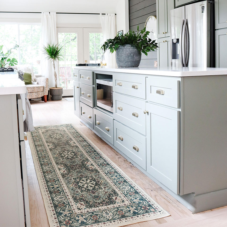 green persian rug in kitchen