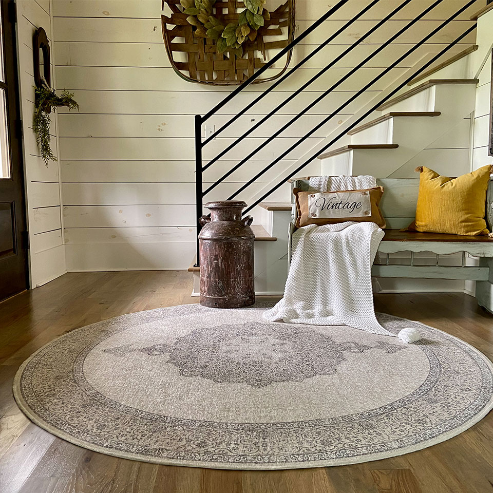 round persian rug in entryway