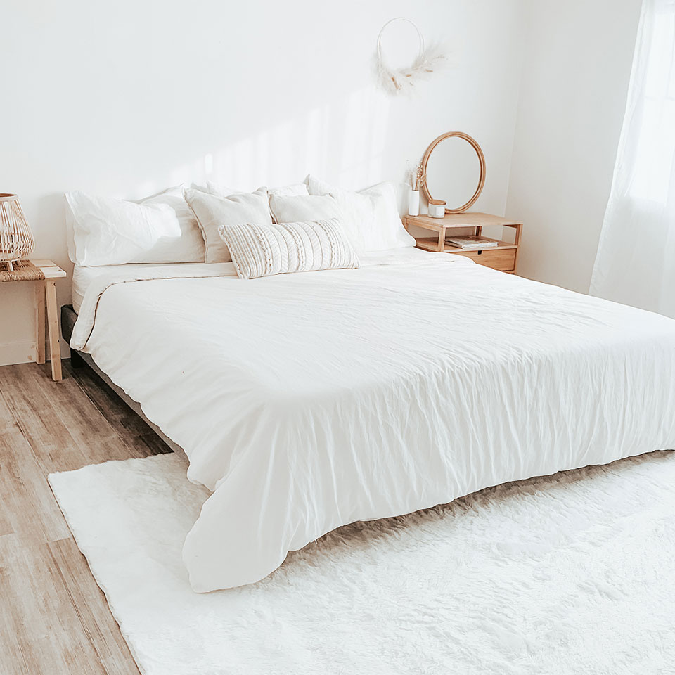 white plush rug in scandi bedroom