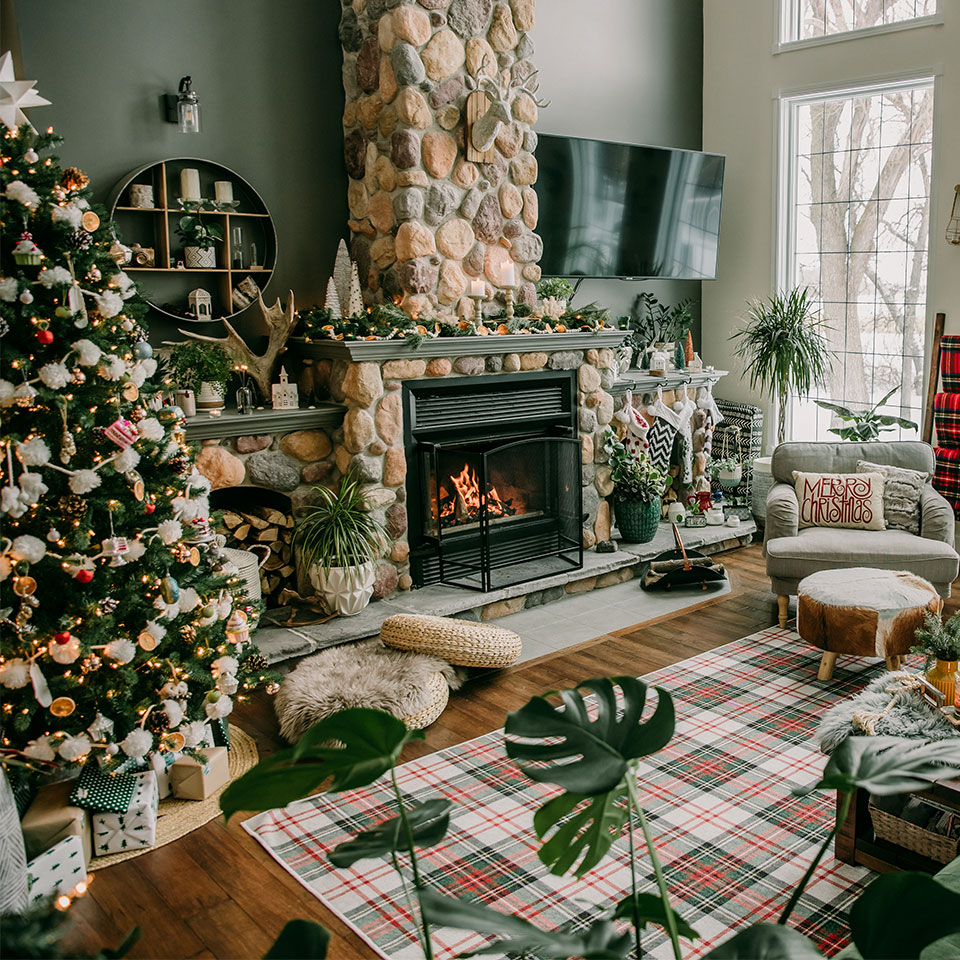 cabin christmas decor in living room with plaid rug